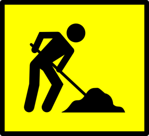 work sign showing person shoveling a pile of dirt