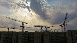 construction cranes wtih a cloudy sky