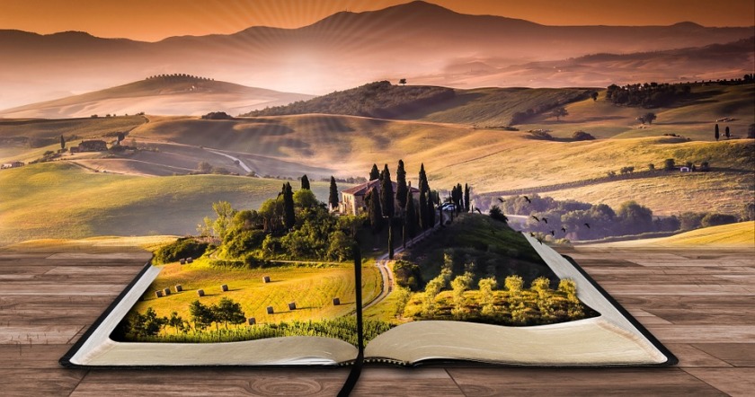 open book with a landscape scene in the pages