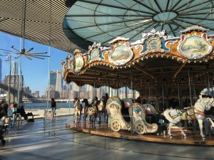 merry go round with city in background