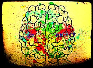 brain withi paint spattered on it and a grungy border